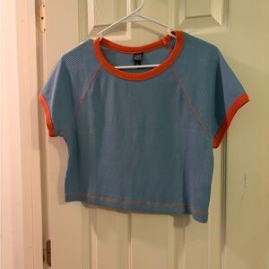 Vibrant Blue Cropped Tee with Orange Accents